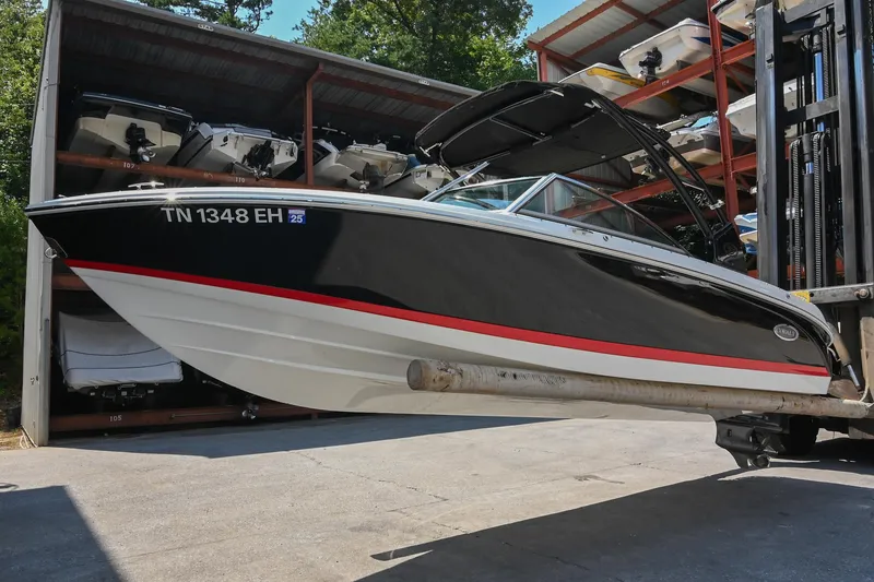 Slide: The Image of 2015 Cobalt 220 boat on forklift in storage facility. - 5