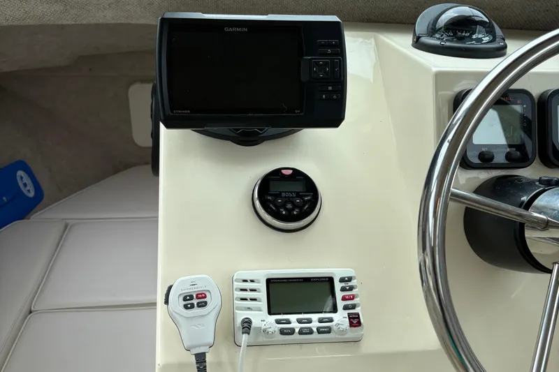 Slide: The Image of Dashboard of a 2012 Parker 2120 Sport Cabin with Garmin GPS and marine radio. - 12