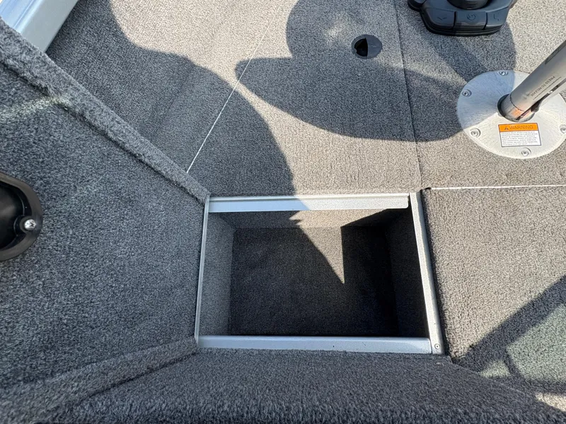 Slide: The Image of 2018 Alumacraft Voyageur 175 Sport boat interior storage compartment. - 16