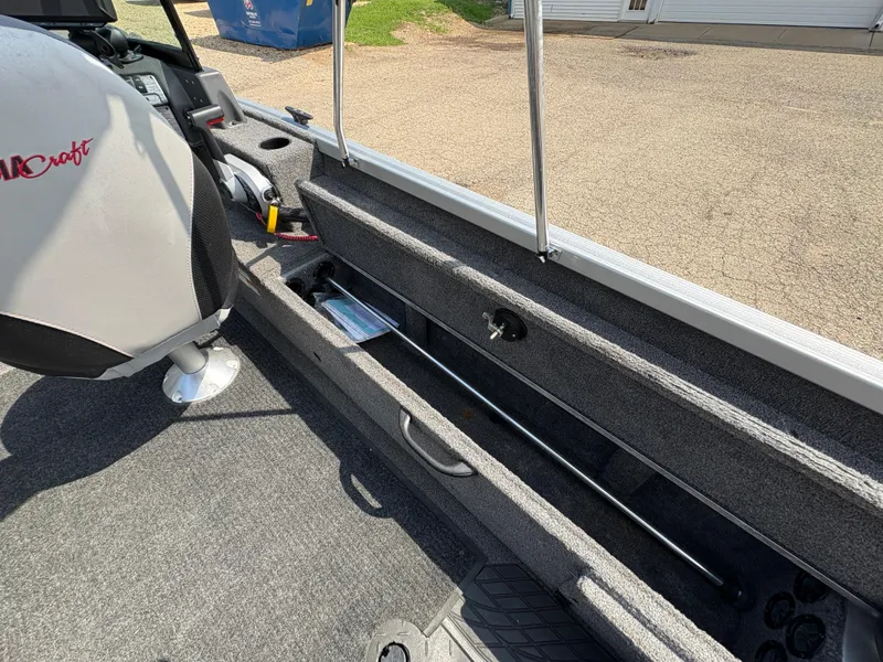 Slide: The Image of 2018 Alumacraft Voyageur 175 Sport interior with storage compartment and seating. - 24