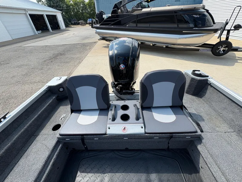 Slide: The Image of 2018 Alumacraft Voyageur 175 Sport boat interior with dual seats and motor. - 26