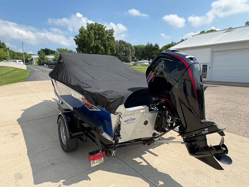 Slide: The Image of 2018 Alumacraft Voyageur 175 Sport boat with cover and outboard motor on trailer. - 32