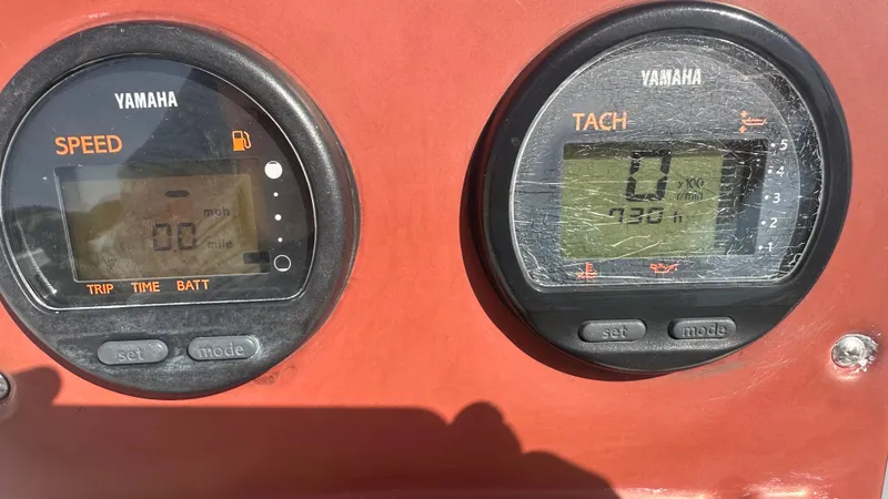 Slide: The Image of Yamaha speed and tachometer gauges on 2012 Sea Hunt Escape 220 LE boat dashboard. - 9