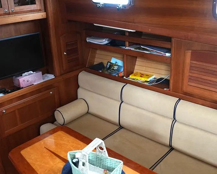 Slide: The Image of Interior of 2006 Sabre 38 Hardtop Express with wooden cabinetry and beige seating. - 12