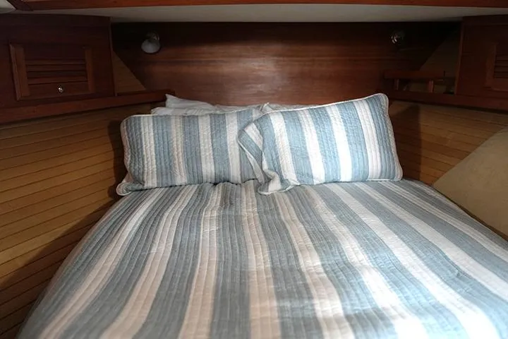 Slide: The Image of Cozy cabin bed with striped bedding in 2006 Sabre 38 Hardtop Express yacht. - 15