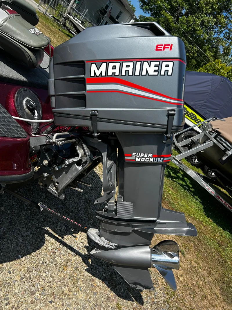 Slide: The Image of 1999 Triton 180 boat with Mariner Super Magnum EFI outboard motor. - 3