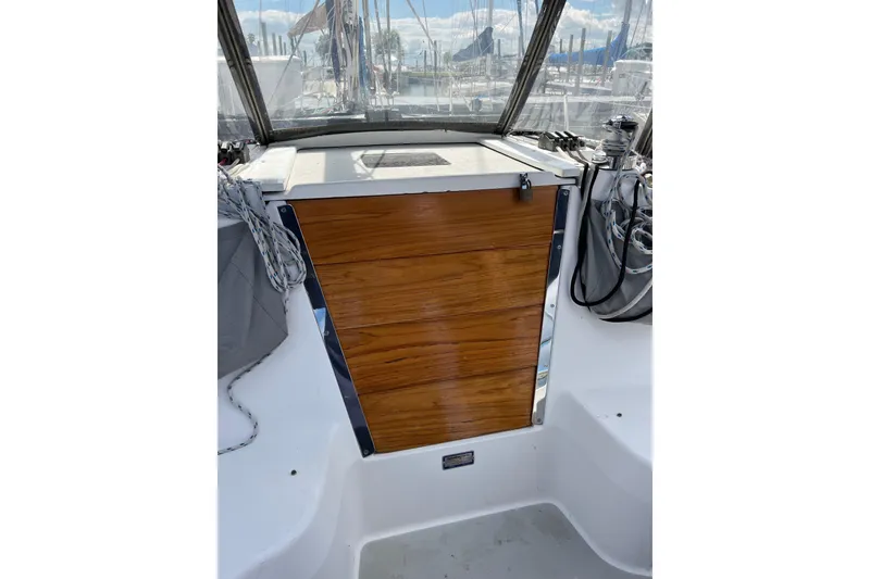 Slide: The Image of Cockpit of 2007 Catalina 309 sailboat with wooden hatch and rigging. - 10