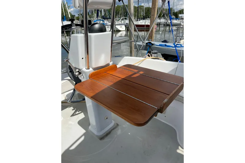 Slide: The Image of Catalina 309 sailboat cockpit with wooden table, 2007 model, docked at marina. - 14