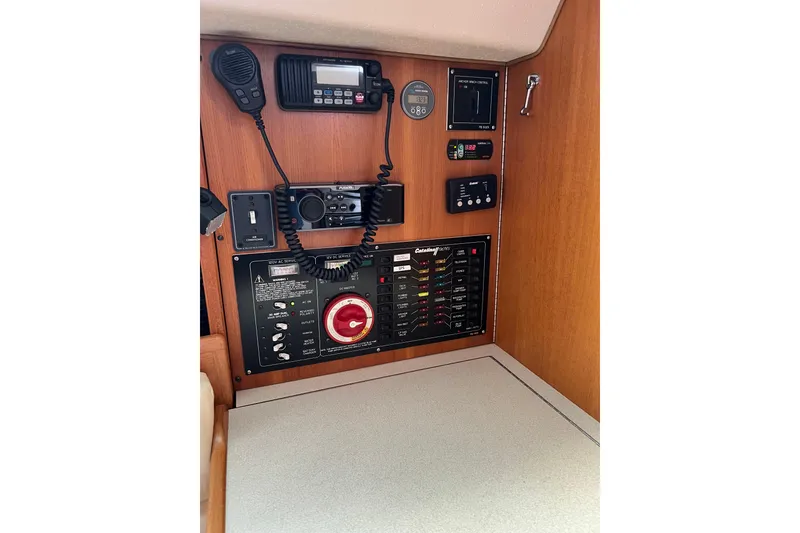 Slide: The Image of Control panel of a 2007 Catalina 309 sailboat with communication and navigation equipment. - 17