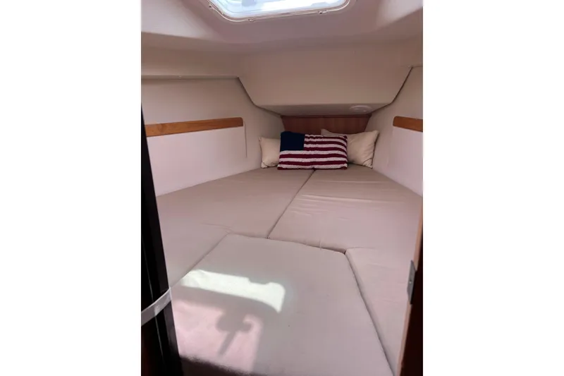 Slide: The Image of Cozy cabin interior of 2007 Catalina 309 sailboat with comfortable bedding and pillows. - 31