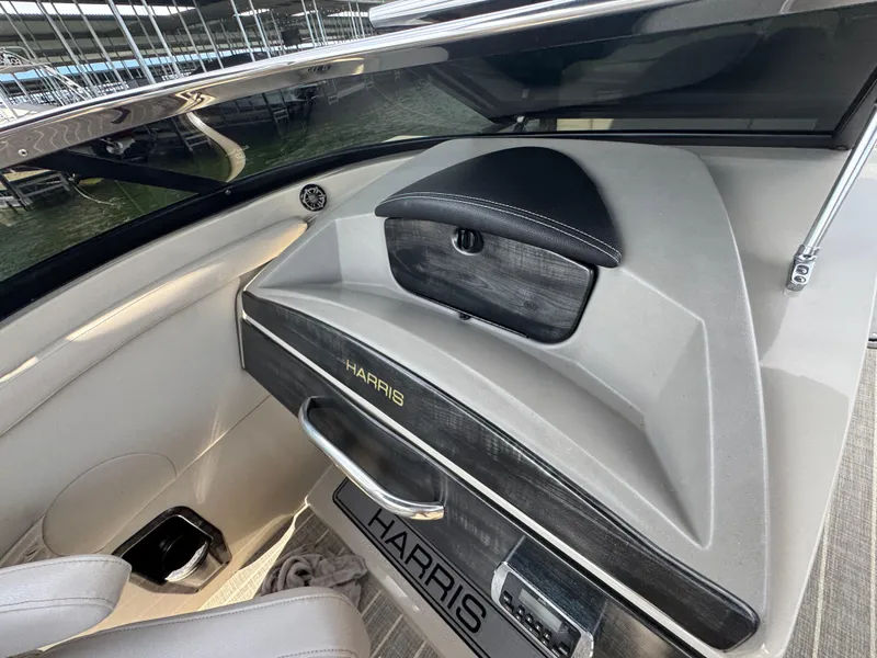 Slide: The Image of Interior of 2016 Harris Solstice DC 250 boat, featuring sleek dashboard design. - 14