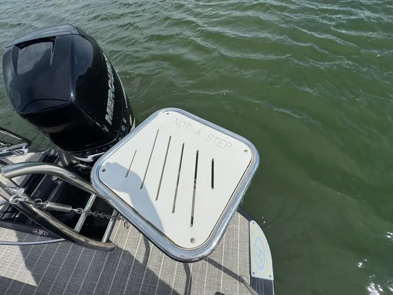 Slide: The Image of 2016 Harris Solstice DC 250 boat with Mercury engine and "Not a Step" warning plate. - 19