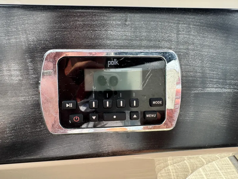 Slide: The Image of Polk audio system on 2016 Harris Solstice DC 250 boat dashboard. - 25