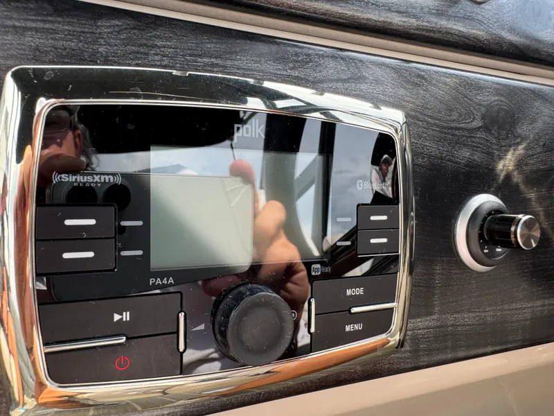 Slide: The Image of Polk audio system in 2016 Harris Solstice DC 250 boat dashboard, featuring SiriusXM and Bluetooth. - 26