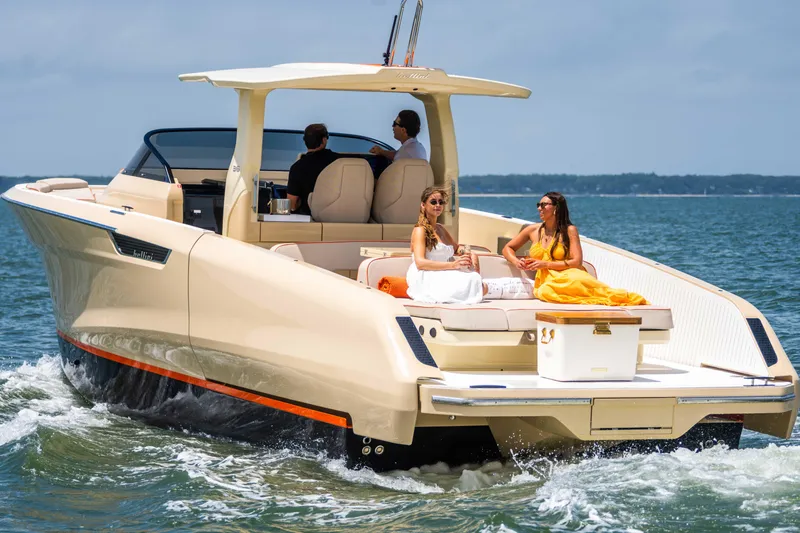 Slide: The Image of Luxury Bellini Astor 36 yacht cruising with passengers, 2026 model, on a sunny day. - 11