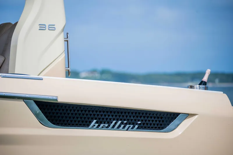 Slide: The Image of Bellini Astor 36 yacht, 2026 model, with champagne bottle on deck. - 6