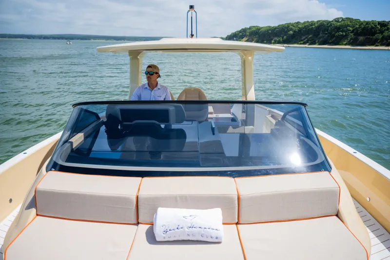 Slide: The Image of 2026 Bellini Astor 36 yacht cruising on a sunny day with a person at the helm. - 9
