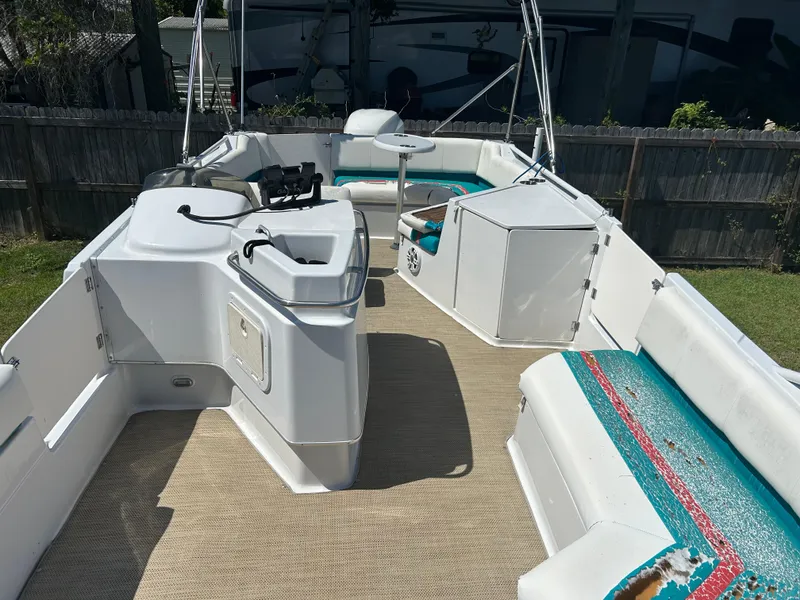Slide: The Image of 1998 Bayliner Rendevous 26 boat interior with seating and helm station. - 8