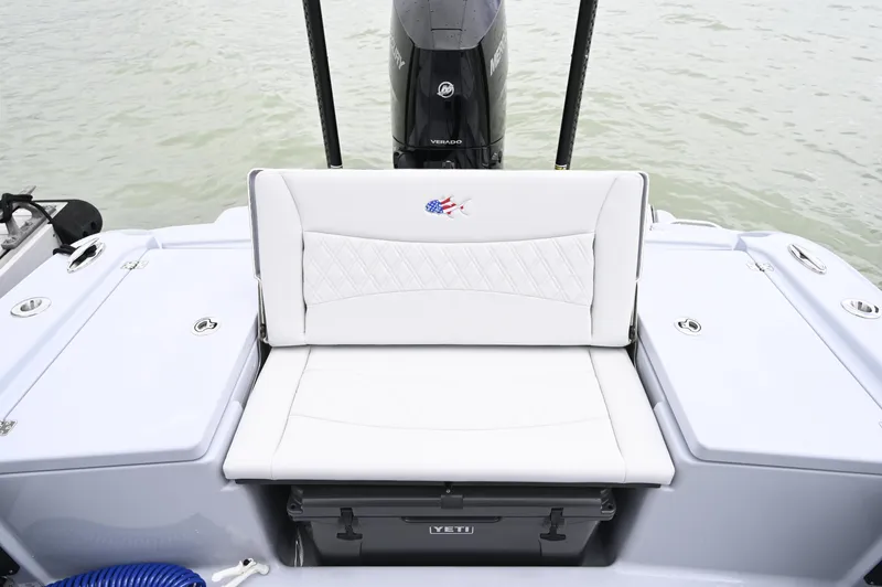 Slide: The Image of 2026 Crevalle 26 HCO boat with Mercury engine in a marina setting. - 10