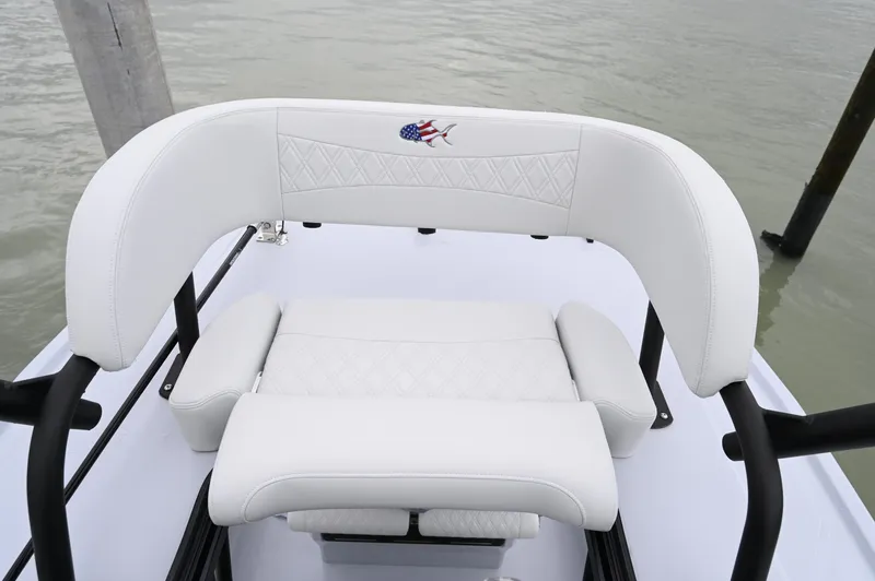 Slide: The Image of Crevalle 26 HCO 2026 boat dashboard with dual Simrad displays and steering wheel. - 11