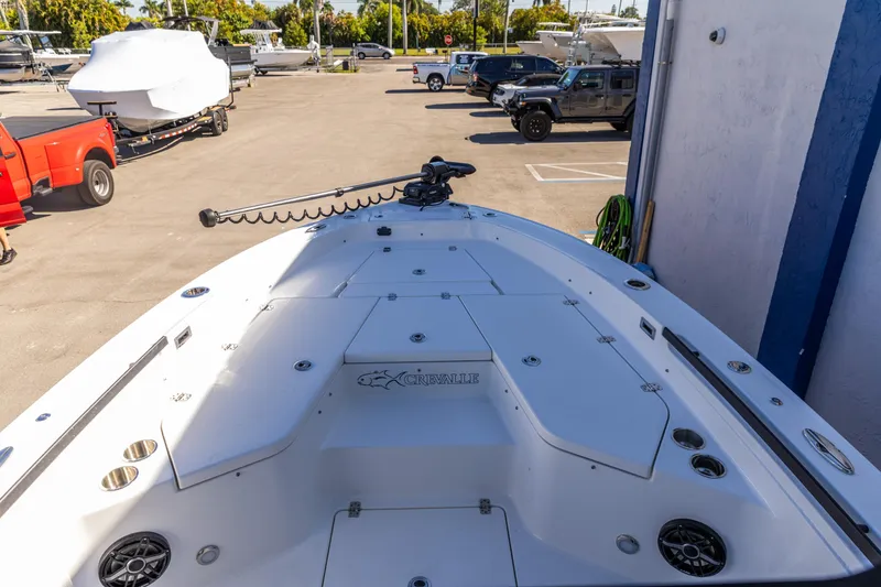 Slide: The Image of 2026 Crevalle 26 HCO boat deck with storage compartments and fishing rod holders. - 15