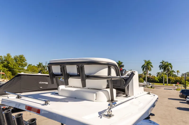 Slide: The Image of 2026 Crevalle 26 HCO boat with seating, parked under clear blue sky. - 19