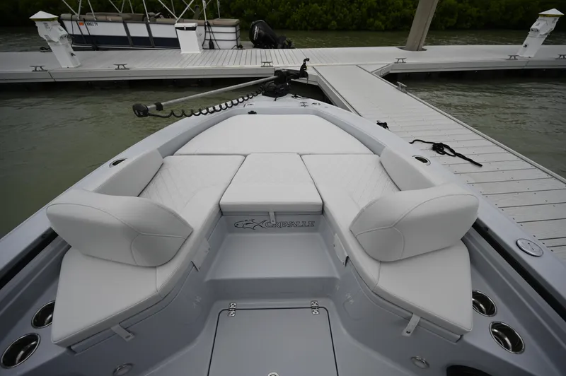 Slide: The Image of Helm of 2026 Crevalle 26 HCO boat with dual Simrad displays and steering wheel. - 2