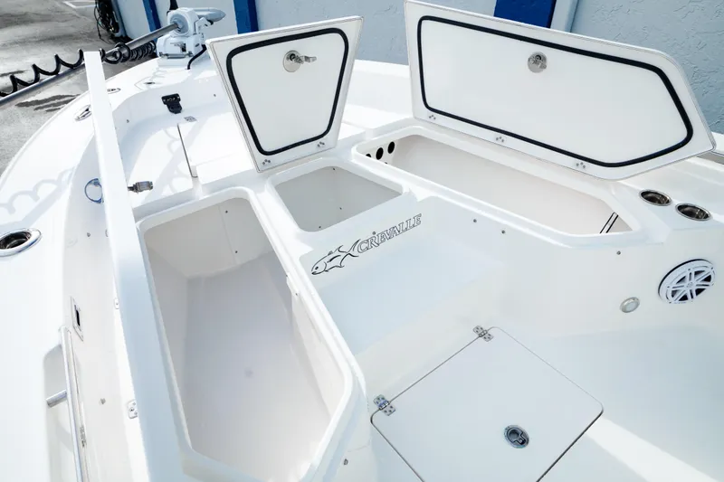 Slide: The Image of 2026 Crevalle 26 HCO boat deck in a sunny marina setting. - 4