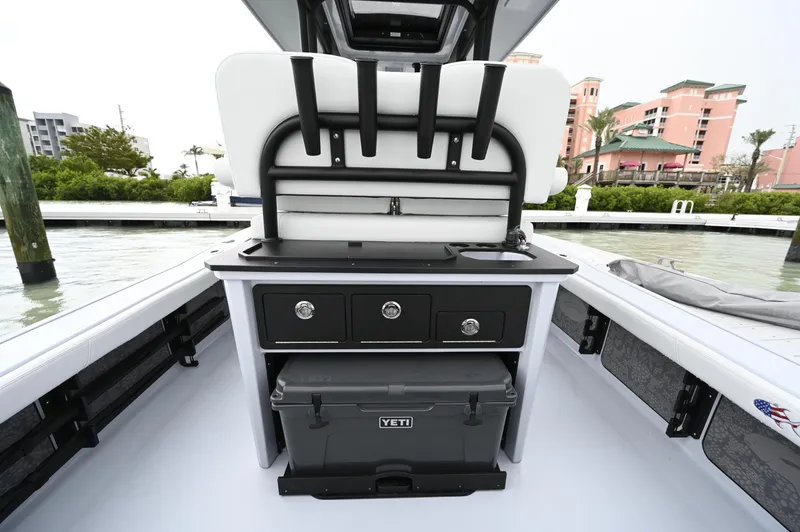 Slide: The Image of 2026 Crevalle 26 HCO boat with Mercury engine, featuring seating and storage compartments. - 7