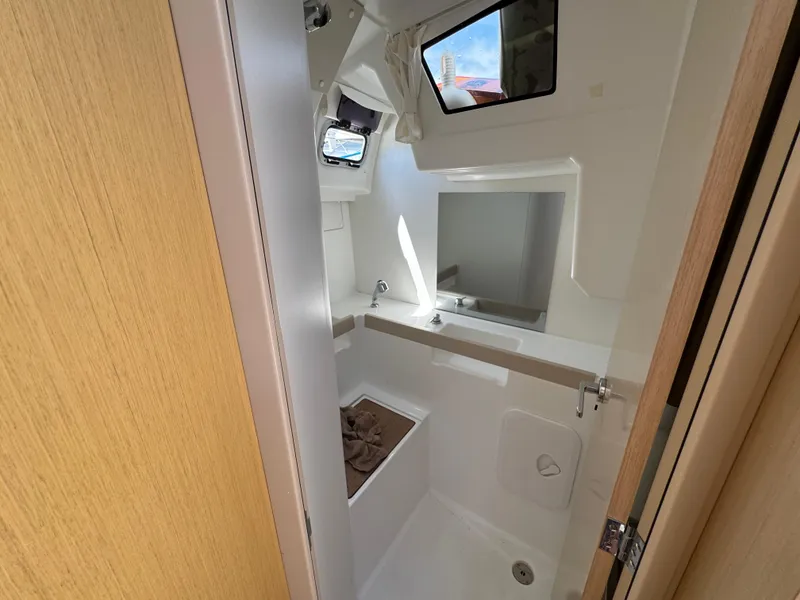 Slide: The Image of Beneteau Oceanis 35.1 2021 yacht bathroom with modern fixtures and natural light. - 13