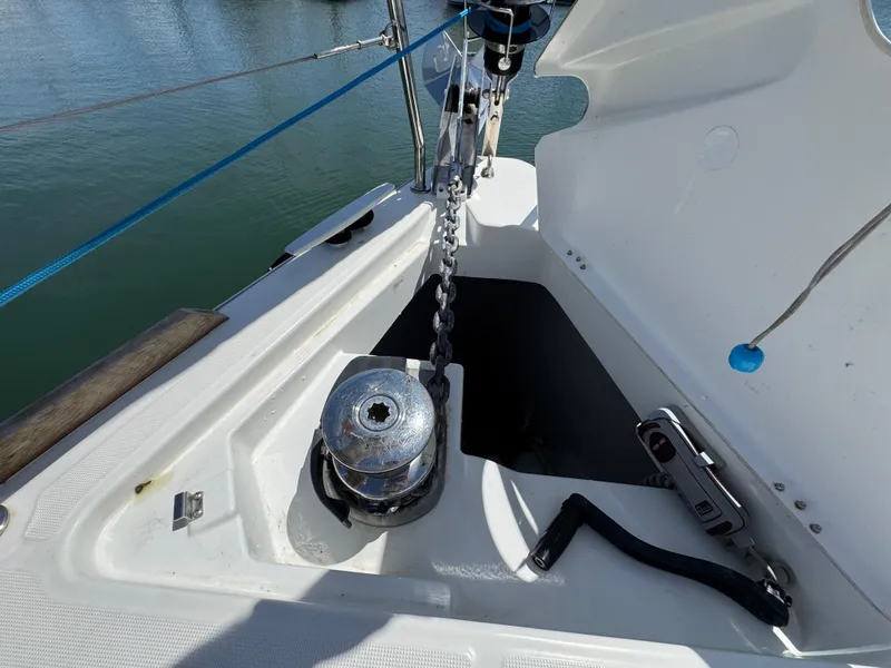 Slide: The Image of Anchor chain and windlass on 2021 Beneteau Oceanis 35.1 sailboat deck. - 22