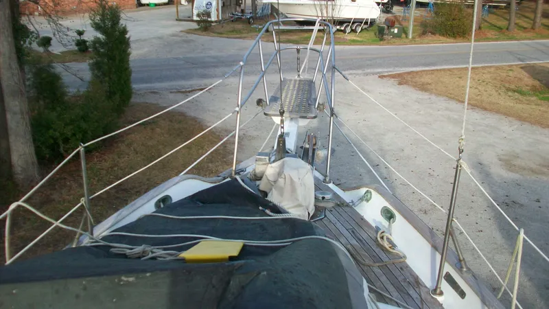 Slide: The Image of 1976 Tayana 37 sailboat deck view with rigging and ropes. - 3