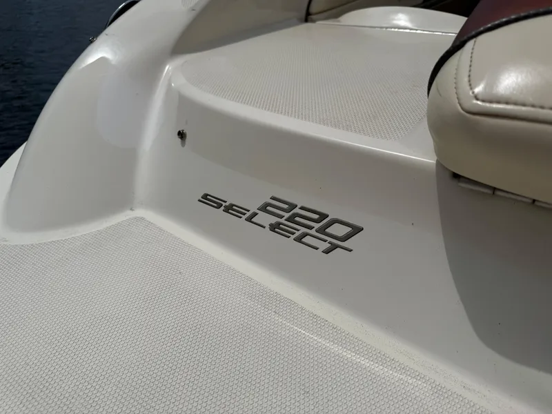 Slide: The Image of 2004 Sea Ray 220 Select boat deck with logo detail. - 17