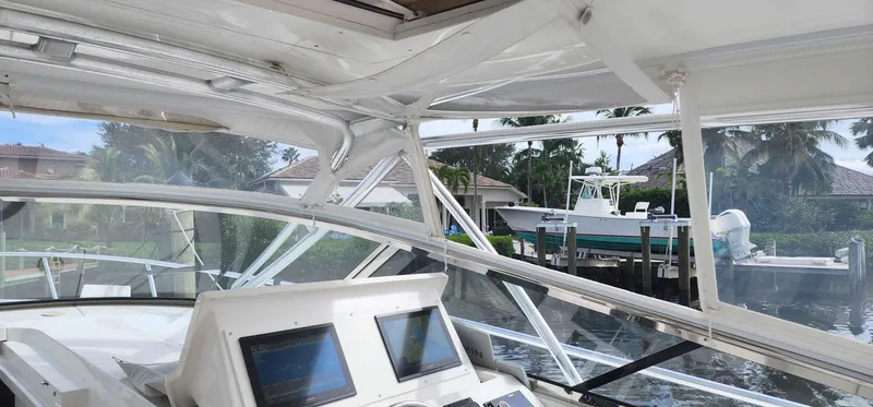 Slide: The Image of Interior view of a 2008 Intrepid 430 Sport Yacht with navigation screens. - 14