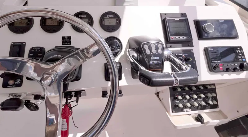 Slide: The Image of 2008 Intrepid 430 Sport Yacht dashboard with steering wheel and control instruments. - 16