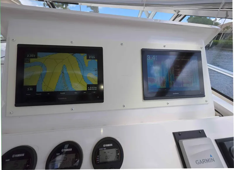 Slide: The Image of 2008 Intrepid 430 Sport Yacht dashboard with Garmin navigation displays and Yamaha gauges. - 17