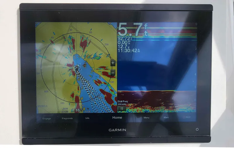 Slide: The Image of Garmin marine display showing navigation and sonar data on Intrepid 430 Sport Yacht, 2008 model. - 21