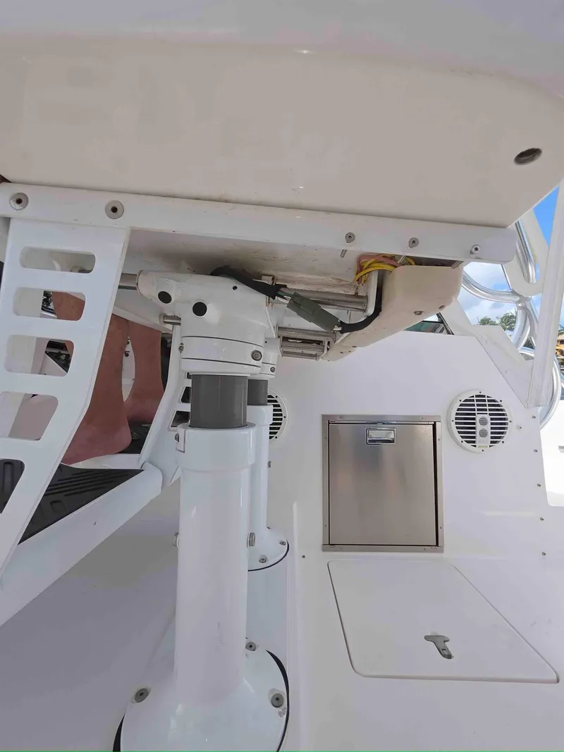 Slide: The Image of 2008 Intrepid 430 Sport Yacht interior, featuring seating and storage compartments. - 22