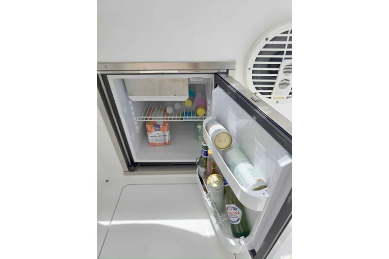 Slide: The Image of Mini fridge stocked with drinks on a 2008 Intrepid 430 Sport Yacht. - 24