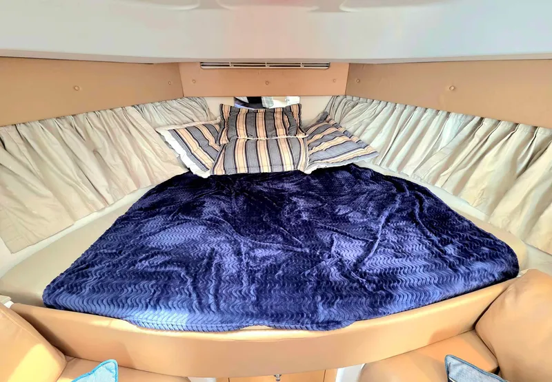 Slide: The Image of Luxurious cabin interior of 2008 Intrepid 430 Sport Yacht with plush bedding and elegant decor. - 28