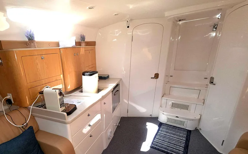 Slide: The Image of Interior of 2008 Intrepid 430 Sport Yacht with kitchenette and modern amenities. - 29