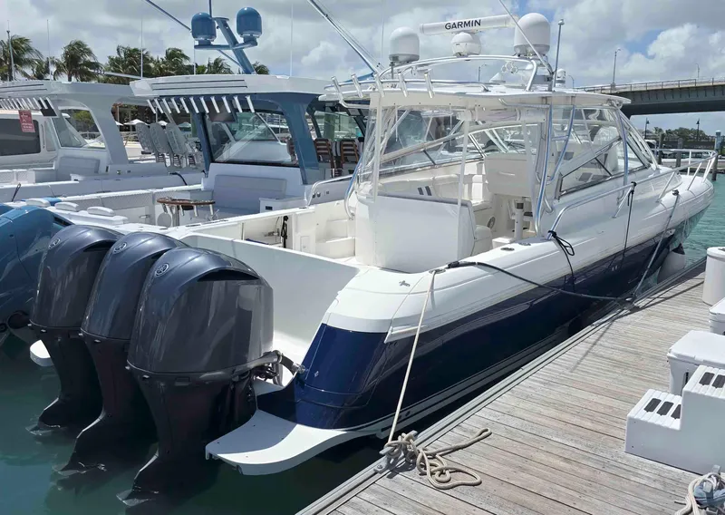 Slide: The Image of 2008 Intrepid 430 Sport Yacht docked with triple outboard engines. - 3
