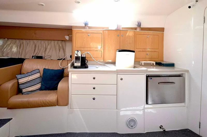 Slide: The Image of Interior of 2008 Intrepid 430 Sport Yacht with kitchenette and seating area. - 30