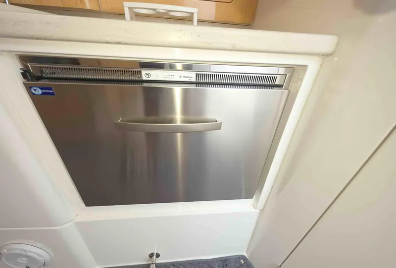 Slide: The Image of Stainless steel dishwasher in 2008 Intrepid 430 Sport Yacht kitchen area. - 33