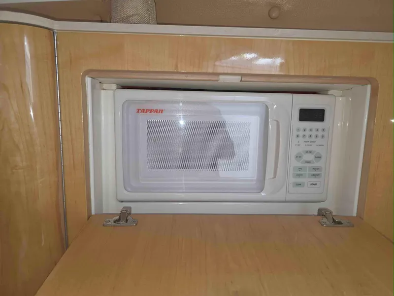 Slide: The Image of Built-in Tappan microwave in 2008 Intrepid 430 Sport Yacht kitchen area. - 36