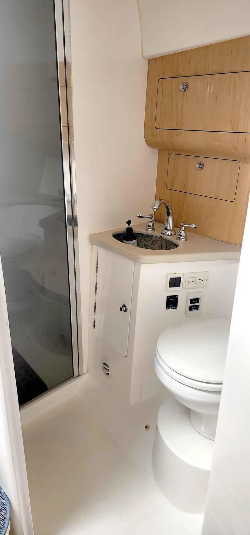Slide: The Image of 2008 Intrepid 430 Sport Yacht bathroom with shower, sink, and toilet. - 42