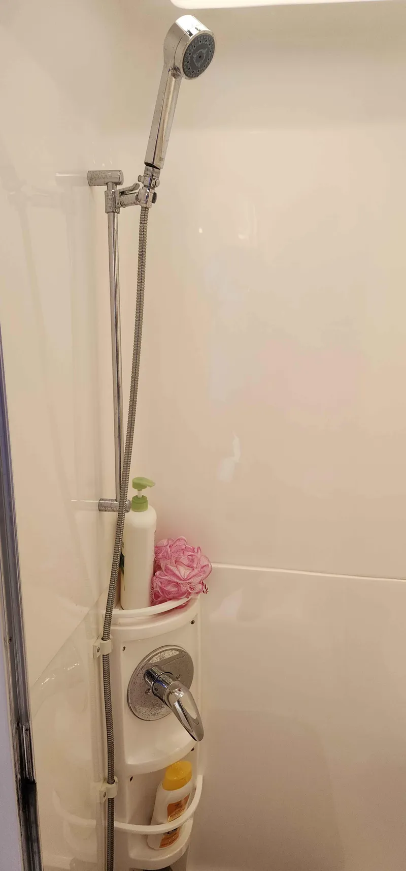 Slide: The Image of Shower area in 2008 Intrepid 430 Sport Yacht with handheld showerhead and toiletries. - 44