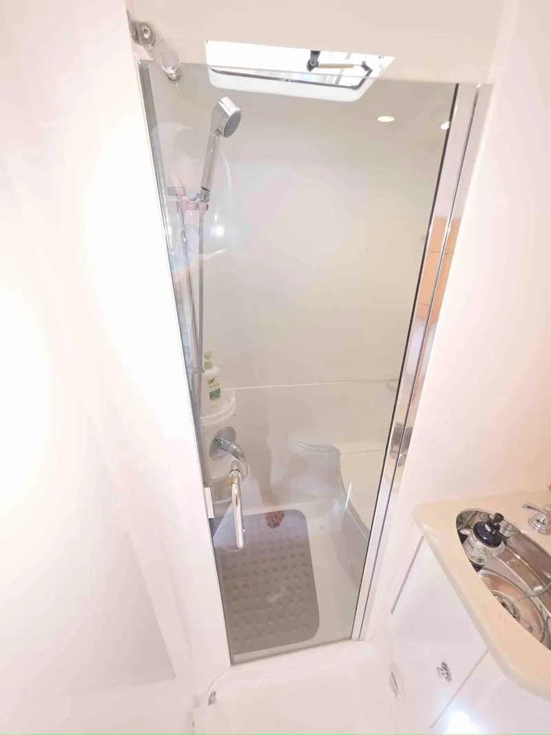 Slide: The Image of Shower area in 2008 Intrepid 430 Sport Yacht with glass door and modern fixtures. - 45