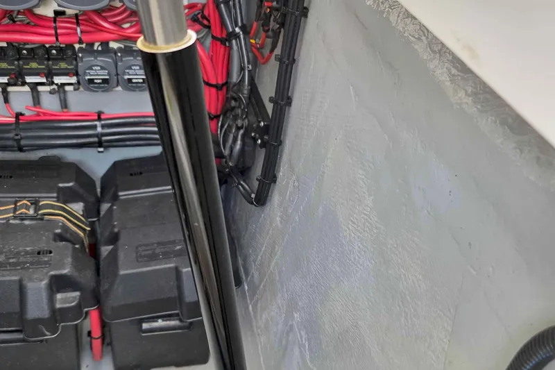 Slide: The Image of Engine compartment of a 2008 Intrepid 430 Sport Yacht with wiring and battery boxes. - 50