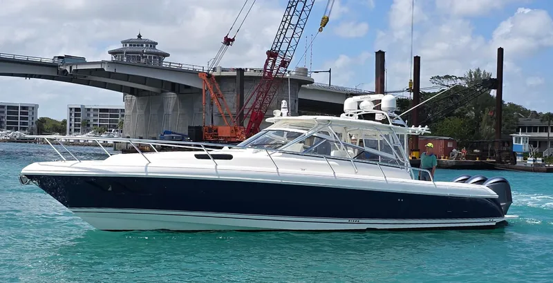 Slide: The Image of 2008 Intrepid 430 Sport Yacht cruising near a bridge on turquoise water. - 55